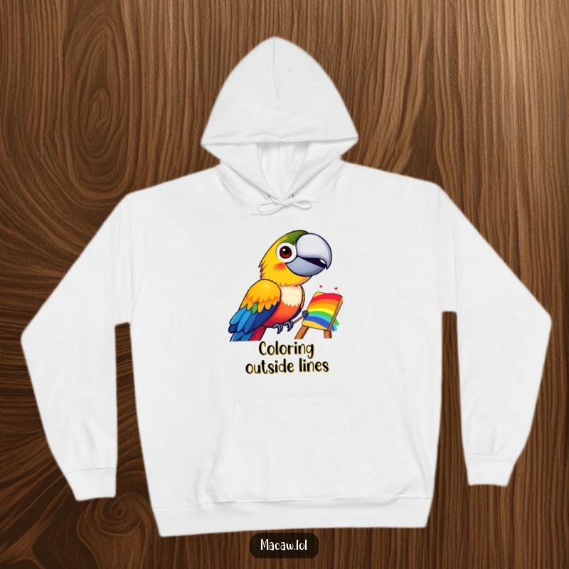 Funny hoodie showcasing a cheerful macaw bird with a wide grin, painting a lively and colorful rainbow on a comfortable garment.