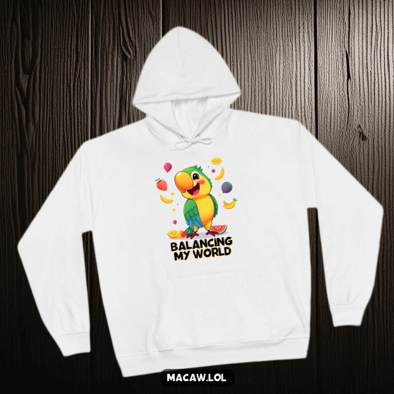 Funny Hoodie featuring a smiling macaw, expertly juggling colorful fruits, offering warmth and a touch of tropical fun.