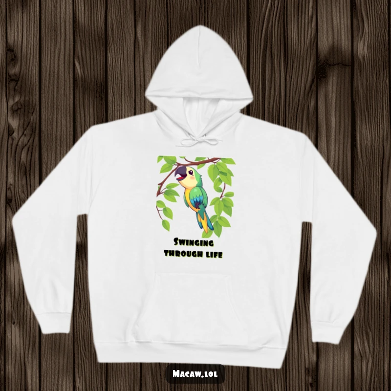 Funny macaw hoodie showing a delighted bird swinging on a vine and singing loudly, offering comfort and joy.