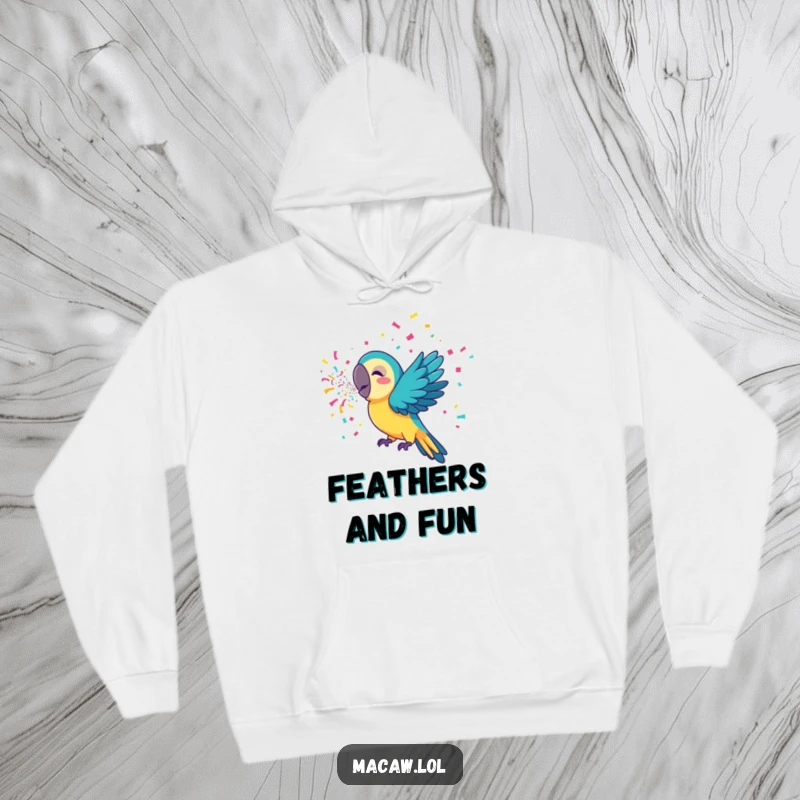 Funny macaw hoodie with a happy bird artistically blowing colorful confetti, ideal for cozying up during festive times.