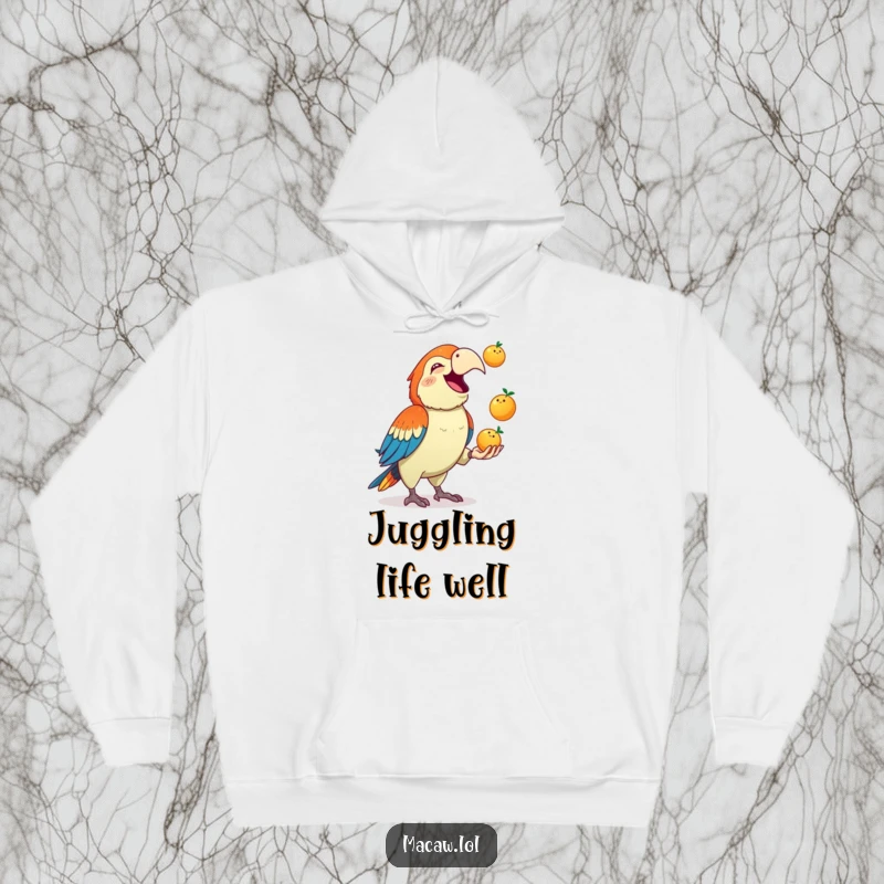 Funny Macaw Hoodie: A cute macaw squawks gleefully while juggling three small fruits, a humorous and warm piece of apparel.