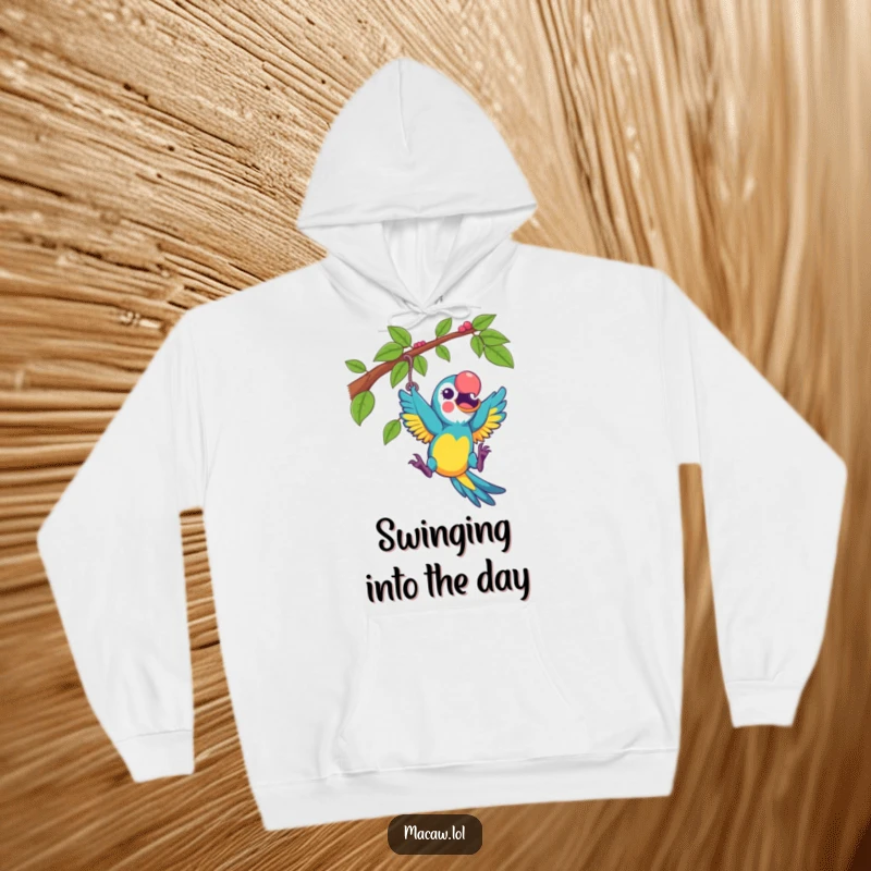 Funny macaw playfully swinging from a vine with excitement, on a cozy hoodie, radiating playful humor.