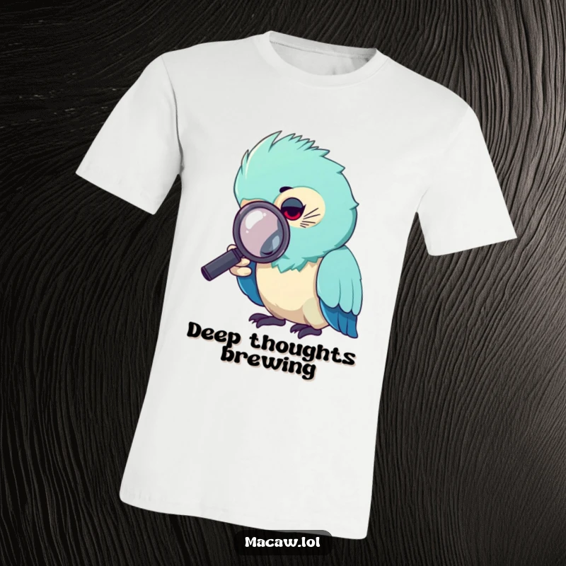 Funny macaw t-shirt, a macaw bird intently peering through a magnifying glass, searching for clues.
