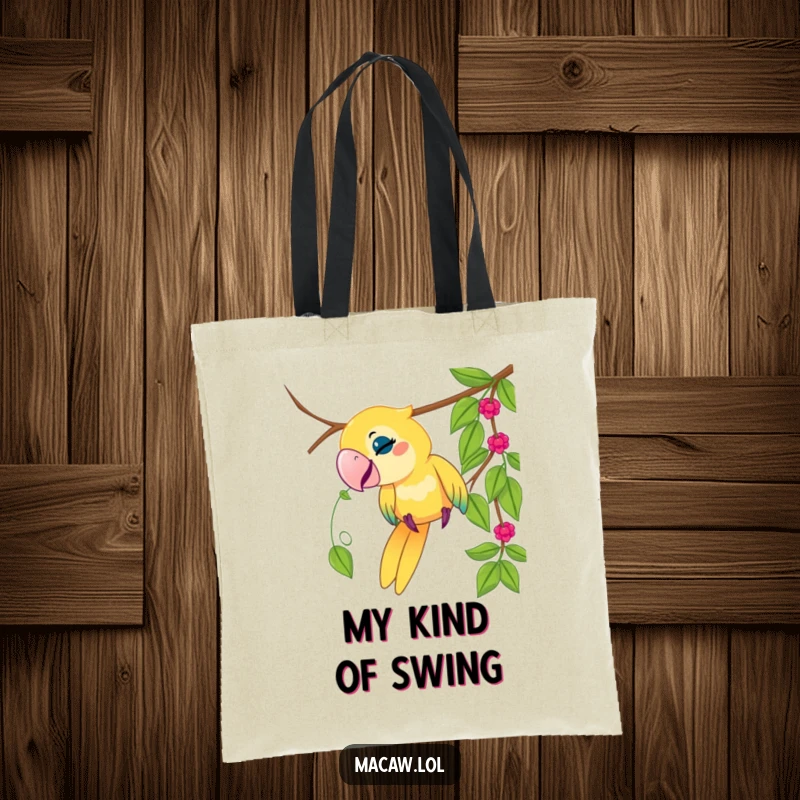 Funny macaw bird tote bag, playful bird tugging on a dangling vine, jungle theme, stylish, humorous accessory, gift.